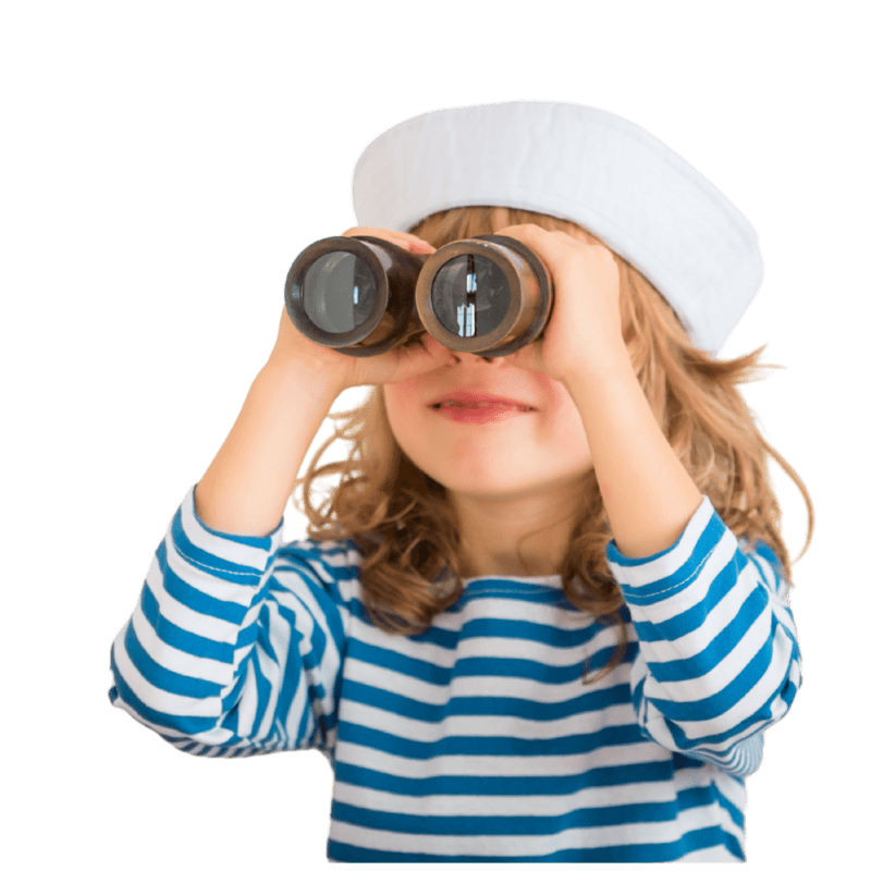 Niña con binoculares explorando conceptos de sostenibilidad.